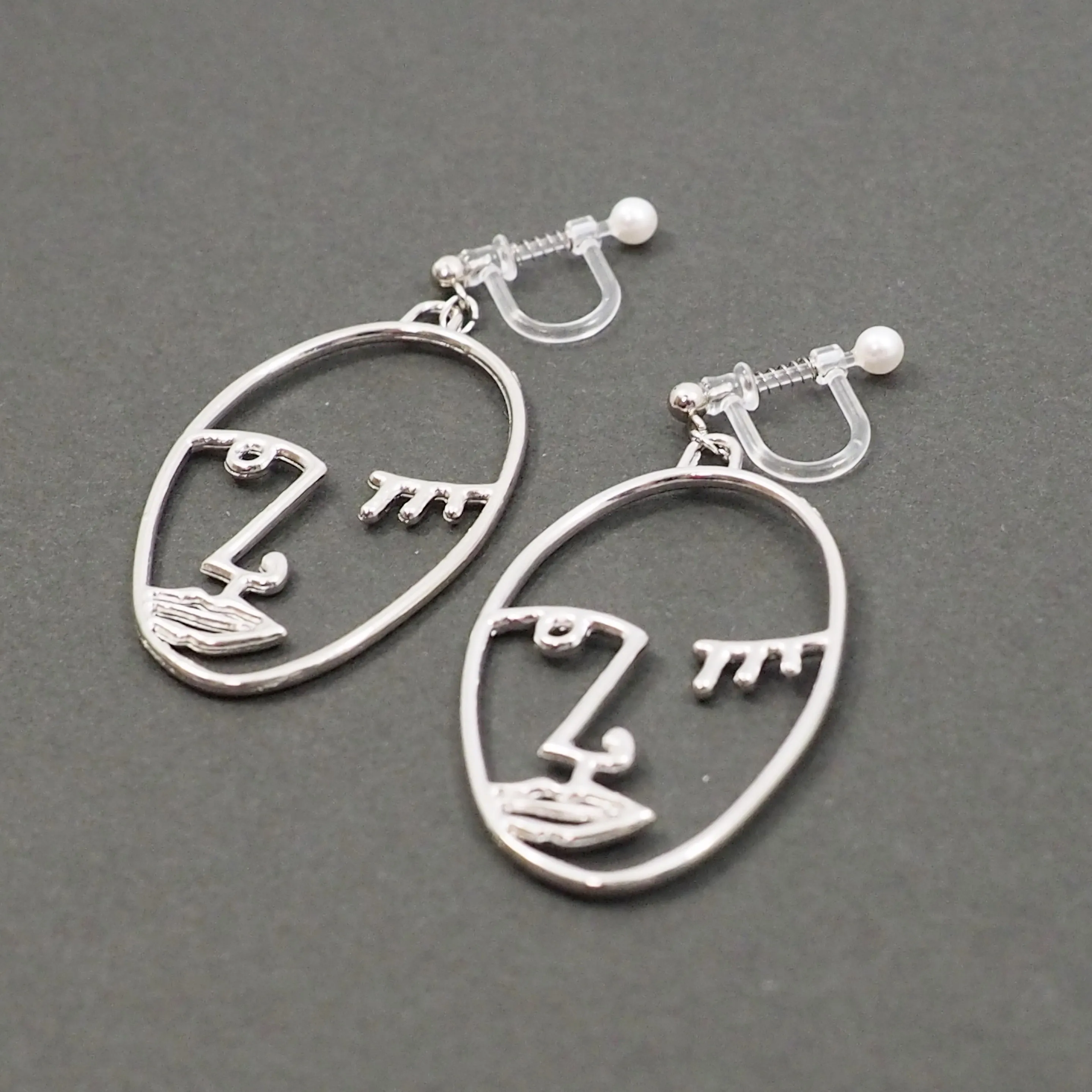 Silver Picasso Face Wink Invisible Clip On Earrings