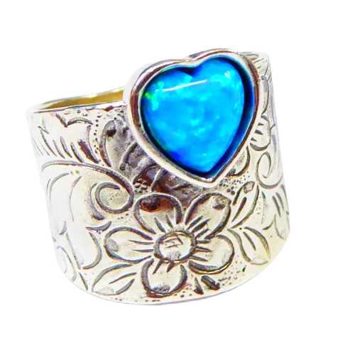 Sterling silver ring for woman set with a blue opal heart