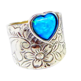 Sterling silver ring for woman set with a blue opal heart