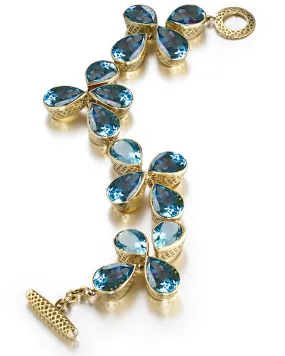 Yellow Gold Bezel Set Blue Topaz Bracelet
